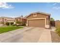 This property features a spacious driveway leading to an attached two-car garage at 3790 S Velero St, Chandler, AZ 85286