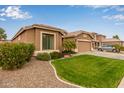 Lovely home featuring lush green grass and desert landscaping at 3790 S Velero St, Chandler, AZ 85286