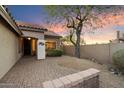 Inviting front porch with brick accents, a tiled walkway, and desert landscaping at 4317 E Williams Dr, Phoenix, AZ 85050