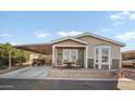 Charming single-story home featuring covered parking, front patio, and well-maintained landscaping in a friendly community at 650 N Hawes Rd # 3607, Mesa, AZ 85207