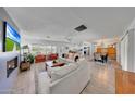 Open concept living and dining area, with hardwood floors and abundant natural light at 6634 N 16Th Dr, Phoenix, AZ 85015