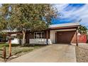 Well-maintained single-story house with an extended carport and easy access driveway at 6720 W Medlock Dr, Glendale, AZ 85303