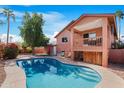 A backyard oasis with a refreshing pool, patio seating, and a well-maintained exterior at 713 N Banning Cir, Mesa, AZ 85205