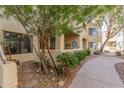 View of the exterior featuring a charming patio area at 7575 E Indian Bend Rd # 1036, Scottsdale, AZ 85250