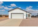 Single Gathering home with attached two car garage and desert landscaping at 9504 W Century Dr, Arizona City, AZ 85123