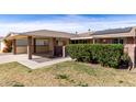 Inviting single-story home with a covered carport, solar panels, and a charming brick-lined entryway at 10816 W Venturi Dr, Sun City, AZ 85351