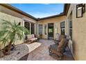 Cozy outdoor patio with comfortable seating and view of the property at 12970 W Kokopelli Dr, Peoria, AZ 85383
