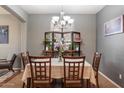 Elegant dining room featuring modern decor and ample space for entertaining guests at 17286 W Morning Glory St, Goodyear, AZ 85338