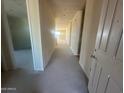 Long hallway with smooth concrete flooring and prepped walls, leading to various rooms of the house at 2447 E Spur Dr, San Tan Valley, AZ 85140