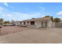 Charming single-story home featuring a nicely landscaped front yard and a covered parking at 248 S 95Th Pl, Chandler, AZ 85224