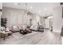 Spacious living room with vaulted ceilings, neutral decor, and ample seating, perfect for entertaining at 30427 W Vale Dr, Buckeye, AZ 85396