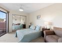 Bright bedroom with a large window, a mirrored closet, and comfortable furnishings at 4141 N 31St St # 405, Phoenix, AZ 85016