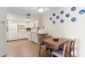 Charming kitchen with white cabinets, modern appliances, and a cozy breakfast nook at 4141 N 31St St # 405, Phoenix, AZ 85016