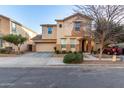 Charming two-story home featuring a stucco exterior, a two-car garage, and a landscaped front yard at 4225 E Carla Vista Dr, Gilbert, AZ 85295