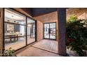 Exterior shot of a tile entry, with a peak into the dining and living spaces at 4434 E Camelback Rd # 128, Phoenix, AZ 85018