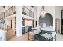 Stylish kitchen with emerald cabinetry, white countertops, stainless steel appliances, and modern lighting at 4434 E Camelback Rd # 128, Phoenix, AZ 85018