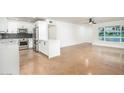 Open floor plan with a modern kitchen and a spacious living room with bright windows at 4735 N 24Th St, Phoenix, AZ 85016