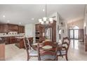 Spacious open-concept kitchen with a granite island, stainless steel appliances, and adjacent breakfast nook at 4937 W Desert Hollow Dr, Phoenix, AZ 85083