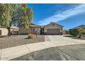 Charming single-story home with desert landscaping, a two-car garage, and a covered entryway at 5225 S Opal Pl, Chandler, AZ 85249