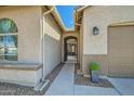 Inviting front entrance showcasing a covered walkway and a glimpse of the charming outdoor living space at 5225 S Opal Pl, Chandler, AZ 85249