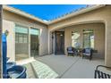 Inviting outdoor patio with comfortable seating, a stylish water feature, and a sliding glass door entrance at 5225 S Opal Pl, Chandler, AZ 85249