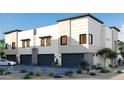 Contemporary townhome showcasing private garages and well-maintained desert landscaping at 651 N Ironwood Dr # 4, Apache Junction, AZ 85120