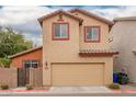 Two-story home featuring a two-car garage, low maintenance yard, and neutral exterior paint at 7172 S 48Th Gln, Laveen, AZ 85339