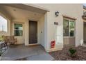 Inviting covered front porch with a rocking chair, and decorative elements. Home number clearly displayed for easy identification at 778 E Harper St # 101, Gilbert, AZ 85297