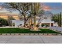 Charming front yard with desert landscaping and a white stucco home exterior at 8713 N 80Th Pl, Scottsdale, AZ 85258