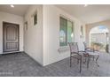 Relaxing front porch with seating area, perfect for enjoying the outdoors at 10633 E Sheffield Dr, Mesa, AZ 85212