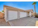 Side view of three car garage with desert landscaping at 1227 W 12Th Ave, Apache Junction, AZ 85120