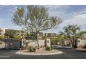 Gated entry to the Copperwynd Villas with desert landscaping and views of the community homes at 14850 E Grandview Dr # 233, Fountain Hills, AZ 85268