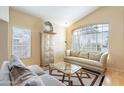 Cozy living room with a large window offering plenty of natural light, comfortable seating, and stylish decor at 15237 S 47Th Way, Phoenix, AZ 85044