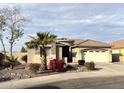 Charming single-story home featuring desert landscaping, a two-car garage, and a tile roof at 2010 E Indigo Dr, Chandler, AZ 85286