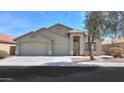 Charming single-Gathering home with desert landscaping, a three-car garage, and a covered entryway at 22139 N Van Loo Dr, Maricopa, AZ 85138