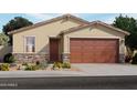 Charming single-story home featuring a two-car garage, stone accents, a covered entryway, and manicured landscaping at 3462 E Audrey Dr, San Tan Valley, AZ 85143