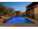 Resort-style pool and spa with a cozy cabana in the backyard at 3756 N Rock Wren Ct, Buckeye, AZ 85396