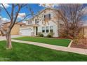 Traditional two-story home, with a manicured lawn and an attached two-car garage at 3760 E Cotton Ct, Gilbert, AZ 85234