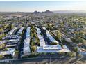 Expansive aerial view of the community showcasing lush landscaping and neighborhood at 6125 E Indian School Rd # 216, Scottsdale, AZ 85251