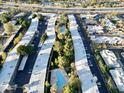 Aerial view featuring community pools nestled between buildings, creating a refreshing oasis at 6125 E Indian School Rd # 216, Scottsdale, AZ 85251