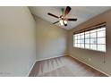 Bedroom with neutral walls, carpeted floor, window with blinds and a ceiling fan with lights at 625 S Westwood St # 108, Mesa, AZ 85210