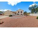 Inviting single-Gathering home with a two-car garage and a beautifully landscaped front yard at 6915 E Gary Cir, Mesa, AZ 85207