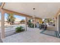 Relaxing covered patio with comfortable seating and a view of the refreshing pool at 7100 E Montgomery Rd, Scottsdale, AZ 85266