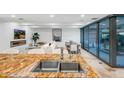 Close-up on a stainless-steel kitchen sink and granite counters with views to the living spaces and patio doors at 7121 E Rancho Vista Dr # 5011, Scottsdale, AZ 85251