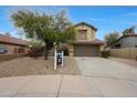 Charming two-story home boasts a desert landscape and a two-car garage at 10212 E Betony Dr, Scottsdale, AZ 85255