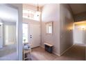 Bright and airy foyer featuring an arched window, modern lighting, and stylish decor at 1054 W Park Ave, Gilbert, AZ 85233