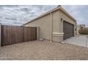 Exterior shot of a home with a fenced yard and a desert landscape at 10705 E Sunflower Ct, Florence, AZ 85132