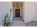 Close up shot of the front entry, showcasing the modern door and minimalist landscaping at 1219 E Seminole Dr, Phoenix, AZ 85022