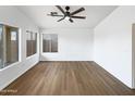 Bright living room with ceiling fan and a view of the backyard at 1405 E Cathedral Rock Dr, Phoenix, AZ 85048