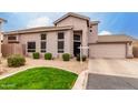 Attractive two-story home featuring low maintenance landscaping, tile roof, and attached garage at 16036 N 11Th Ave # 1126, Phoenix, AZ 85023